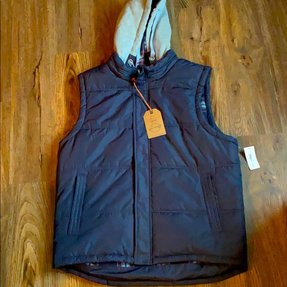 Weatherproof hooded vest.